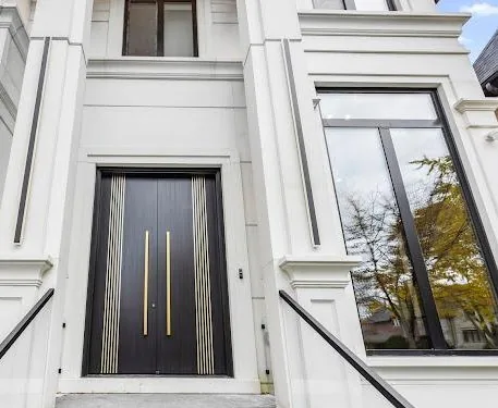 Kaizen 2000 Construction — premium custom front entry with black and gold door