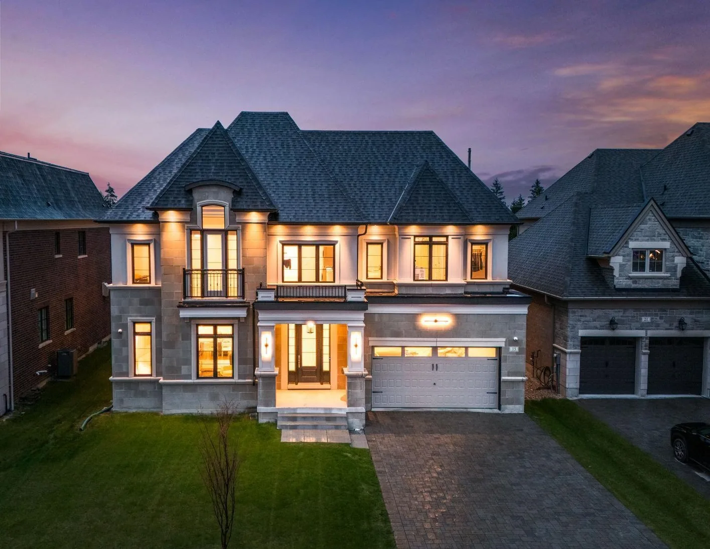 Kaizen Construction Group custom home exterior at dusk, Keswick ON