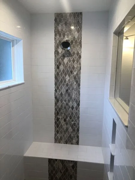 Walk-in shower with arabesque mosaic feature band