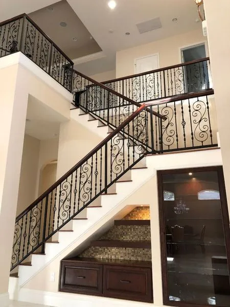 Hardwood staircase with wrought-iron railings